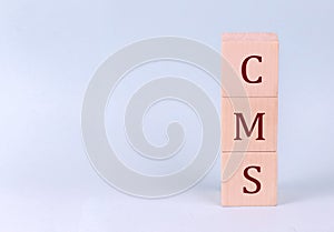 SPONSORS WELCOME text on the wooden block, blue background