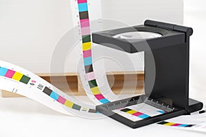 CMYK printing color bar and loupe.