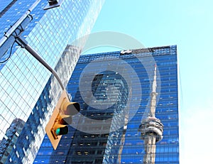 CN Tower reflected in Marsh & McLennan skyscraper in Toronto.