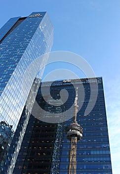 CN Tower reflected in Marsh & McLennan skyscraper in Toronto.