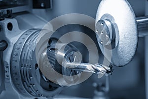 The CNC cutting tool grinding machine control by CNC program.