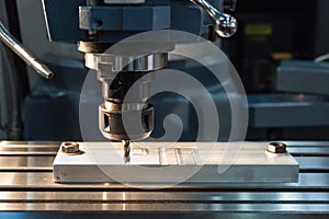 CNC ENGRAVER working in factory photo