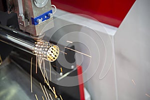 The CNC fiber laser cutting machine cutting the stainless pipe.