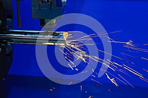 The CNC fiber laser cutting machine cutting the stainless pipe