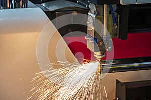 The CNC fiber laser cutting machine cutting the stainless pipe.