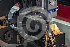 The CNC fiber laser cutting machine cutting the stainless square pipe .