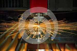 CNC laser cuting operate cuting steel photo