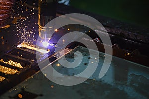 CNC laser cutting machine cutting the metal plate