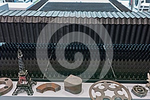 Cnc laser machining center. Laser cutting center. CNC laser metal processing. Laser cutting machine