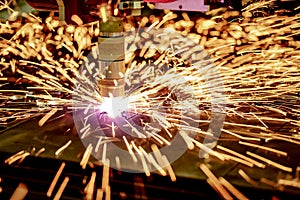 CNC Laser plasma cutting of metal, modern industrial technology.