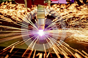 CNC Laser plasma cutting of metal, modern industrial technology.