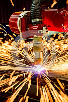 CNC Laser plasma cutting of metal, modern industrial technology.