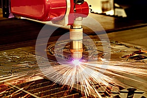 CNC Laser plasma cutting of metal, modern industrial technology.