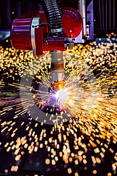 CNC Laser plasma cutting of metal, modern industrial technology.