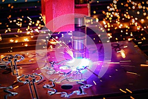 CNC Laser plasma cutting of metal, modern industrial technology.