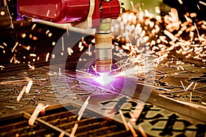 CNC Laser plasma cutting of metal, modern industrial technology.