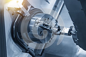 The CNC lathe or turning machine use the robot arm