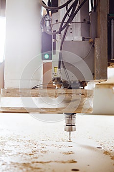 Cnc machine working, cutting wood. Woodwork industry.