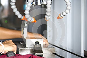 CNC machining center setting work metal by CNC operator or man a