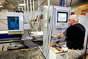 CNC Mill operator in a cabinet shop