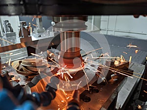 Cnc milling of hardened steel with sparks - closeup with selective focus and blur