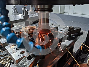 Cnc milling of hardened steel with sparks - closeup with selective focus and blur