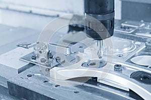 The CNC milling machine cutting the aluminium automotive part