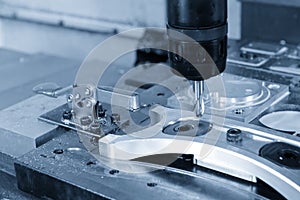 The CNC milling machine cutting the automotive part