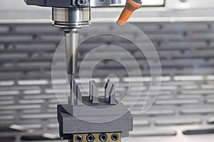 The CNC milling machine cutting the graphite electrode parts