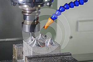 The CNC milling machine cutting injection sample part by solid ball end mill tool