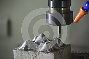 The CNC milling machine cutting injection sample part by solid ball end mill tool