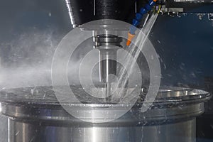 The CNC milling machine cutting the magnesium alloy wheel part with ball end mill tool