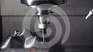 The CNC milling machine cutting mold part by indexable ball tool