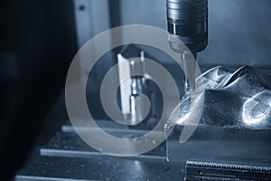 The CNC milling machine cutting the mold parts with index-able ball endmill tools.