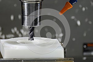 The CNC milling machine cutting the nylon 6 material part with flat end mill tool