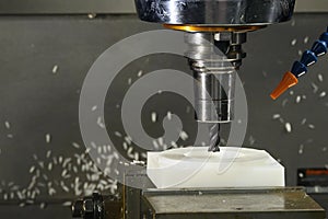 The  CNC milling machine cutting the nylon 6 material part with ball end mill tool