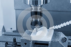 The CNC milling machine cutting the plastic material parts by solid ball endmill tool