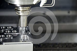 The CNC milling machine cutting the sample part.