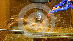 The CNC milling machine cutting the tire mold parts with oil coolant method.