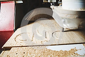 CNC milling machine. Machine tool in wood factory with drilling machines.