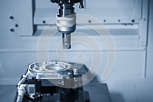 The CNC milling machine rough cutting  the aluminum die casting parts by indexable  endmill tools.