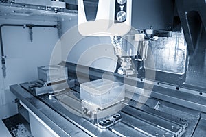 The CNC milling machine rough cutting the injection mold parts by face-mill tools.