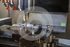 The CNC milling machine rough cutting  the injection mold parts by indexable  endmill tools.