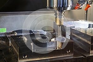 The CNC milling machine rough cutting  the injection mold parts by indexable  endmill tools.