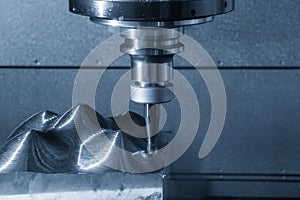 The CNC milling machine rough cutting  the injection mold parts by indexable  endmill tools.