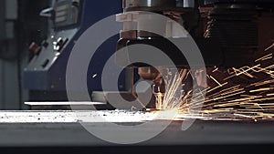 CNC plasma machine cuts metal creating sparks close view