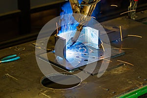 CNC robotic mig welding of half inch steel parts photo