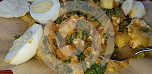 CNN winning top food called gado gado, or lotek, consists of various vegetables, eggs, tempeh, and lontong with peanut sauce photo