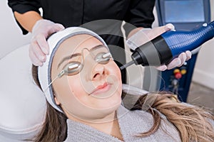 CO2 fractional ablative laser being used for skin rejuvenation skin resurfacing as a medical cosmetic procedure in a beauty photo