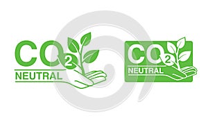 CO2 neutral stamp with - hand holding plant photo